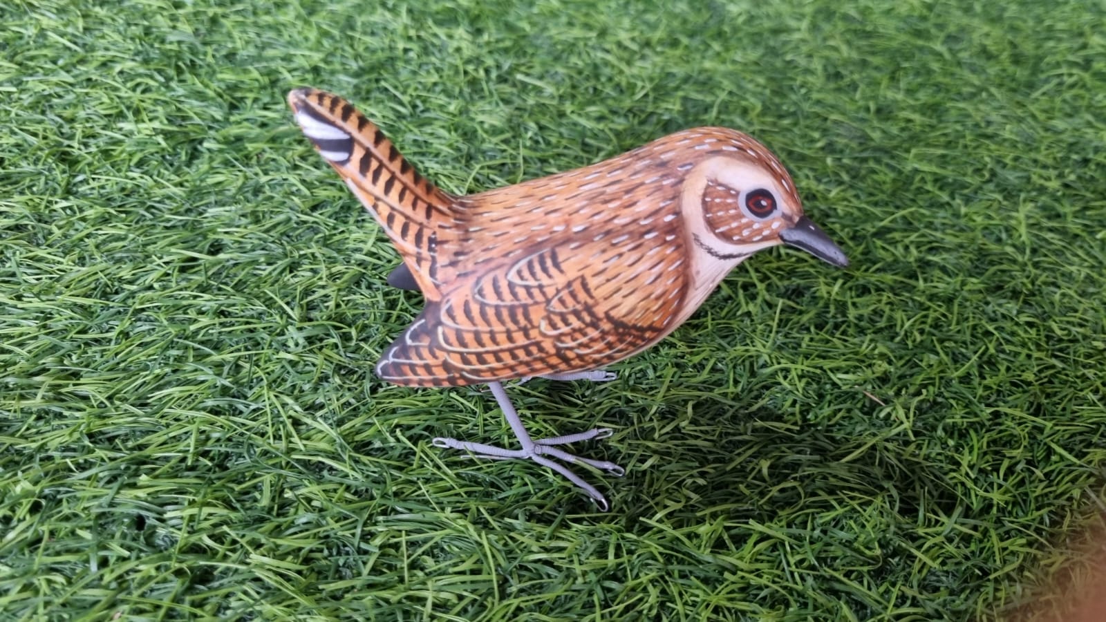 hand-carved-wooden-bird-with-detailed-brown-feather-patterns