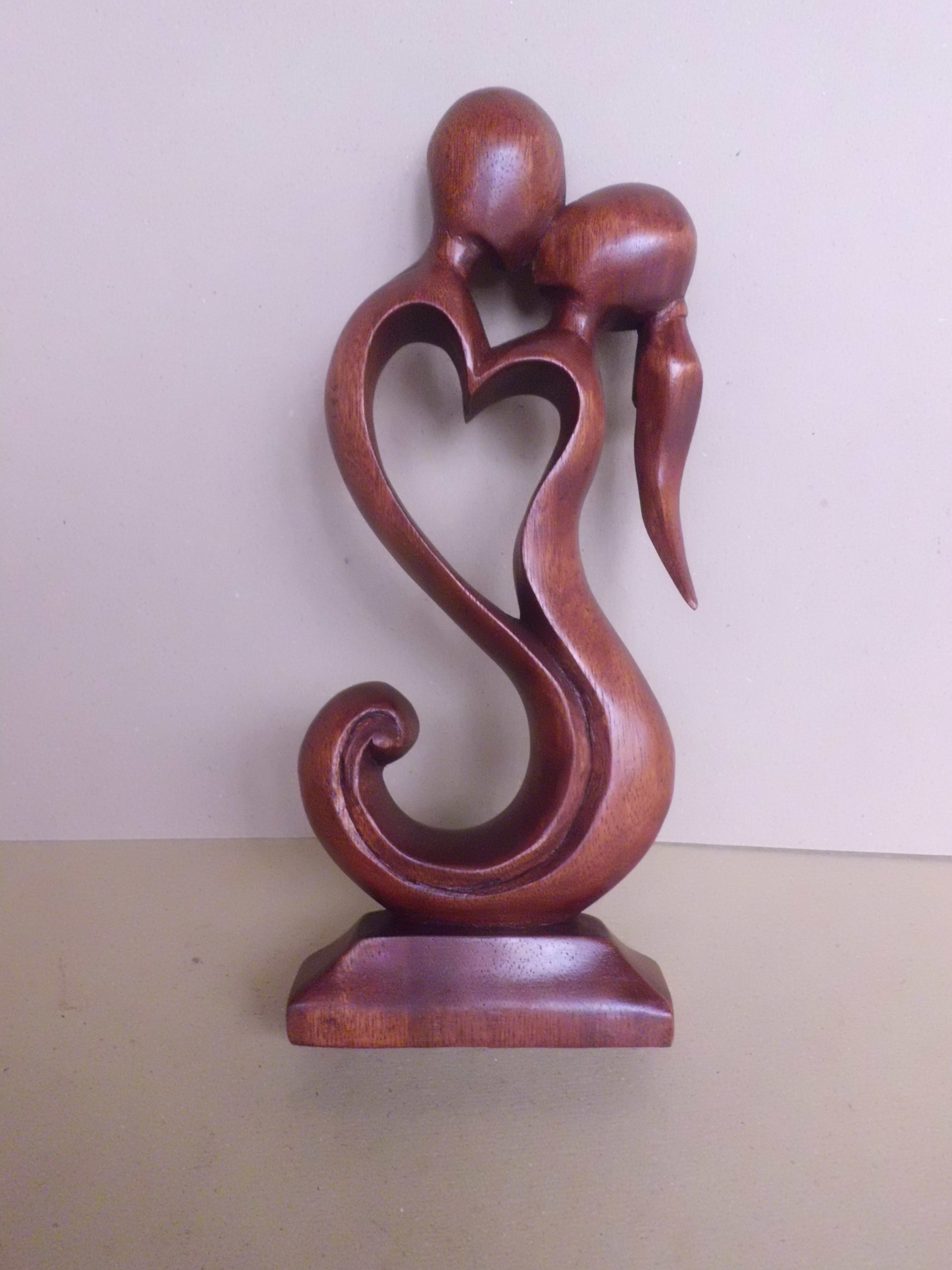 hand-carved-abstract-sculpture-kissing-figures-with-heart-design